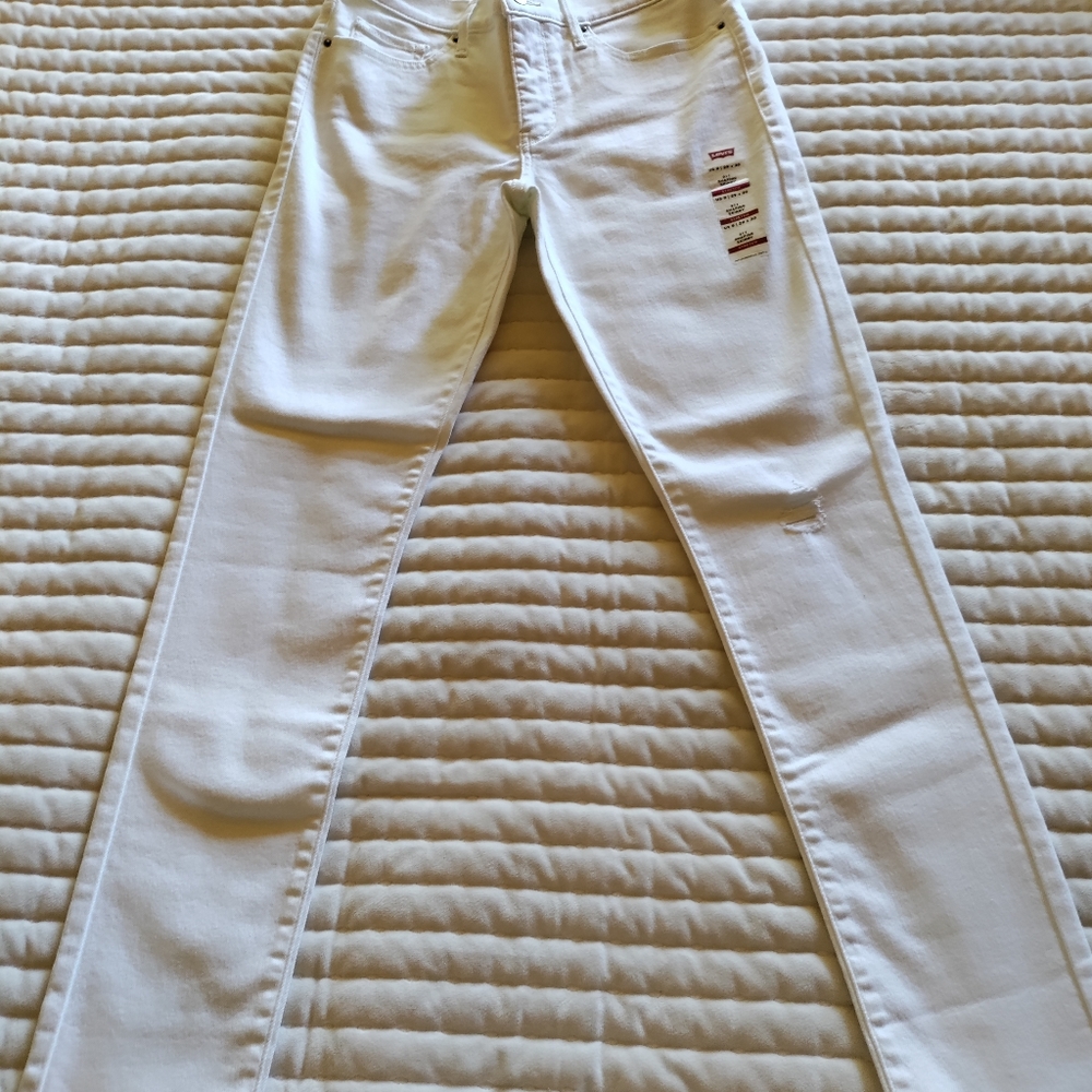 311 shaping skinny white distressed Levi's jeans.